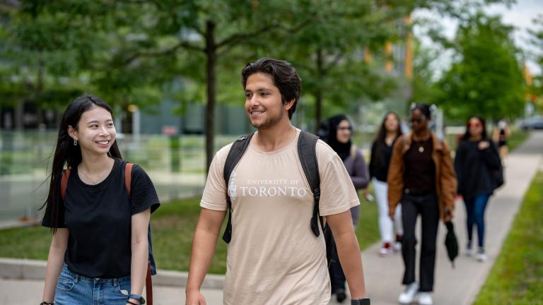 Students on a tour of the U of T Scarborough campus, one wearing a University of Toronto t-shirt