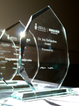 Dr. Jon Dellandrea Award statuette