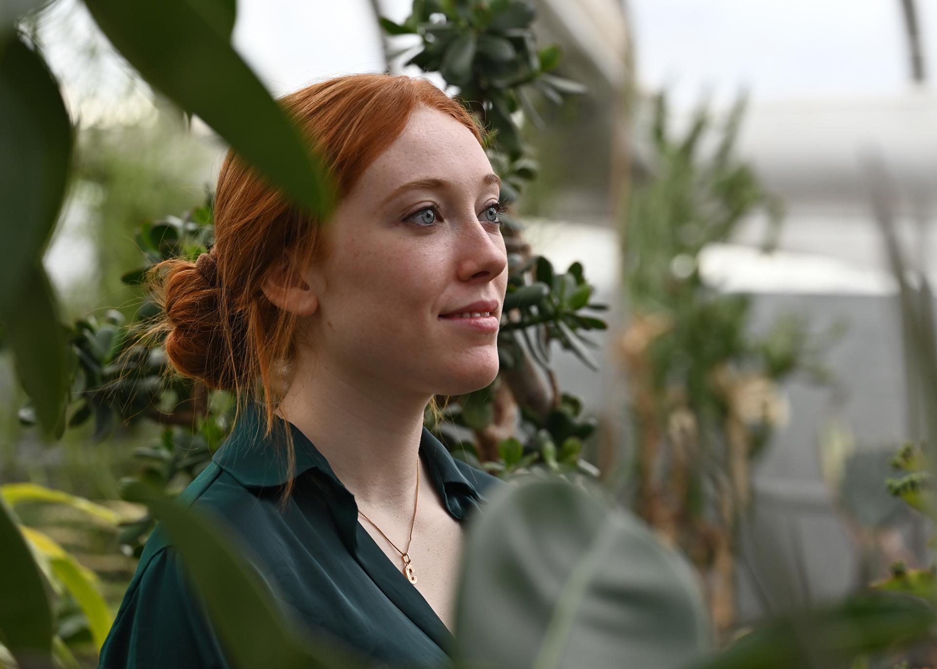 A photo of Charlotte Wargniez in a greenhouse