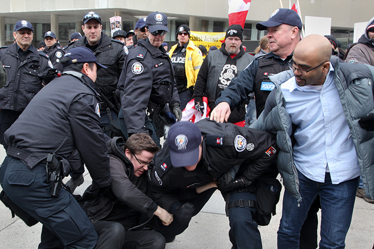 Demonstrators grapple with police