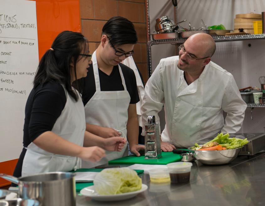 Daniel Bender working with students in the test kitchen at U of T Scarborough.
