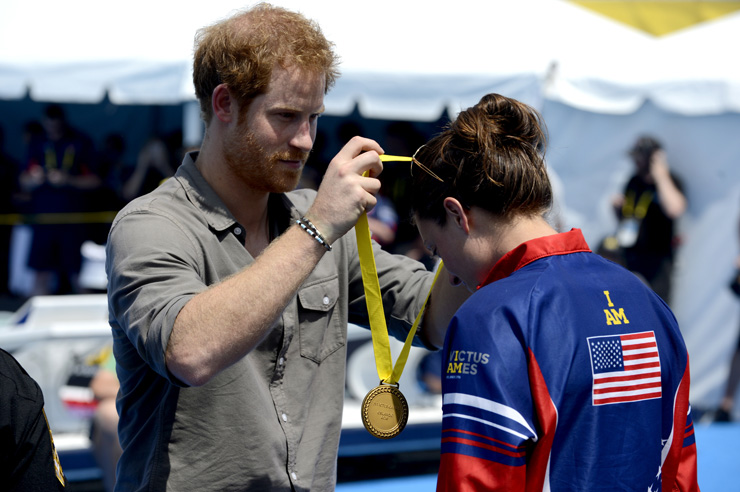 Prince Harry awarding a medal to an Invictus champion.