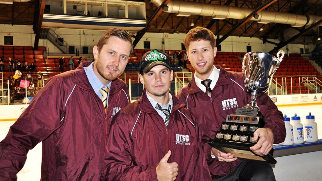 Greg Danko (far right) with Andrew Myszkowski (left) and Brodie Fitzpatrick (middle) with the East-West Hockey Classic Trophy in-hand.