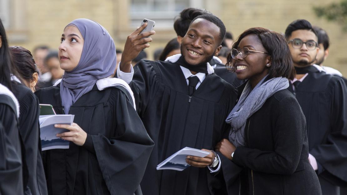 Students posing for selfie at convocation 