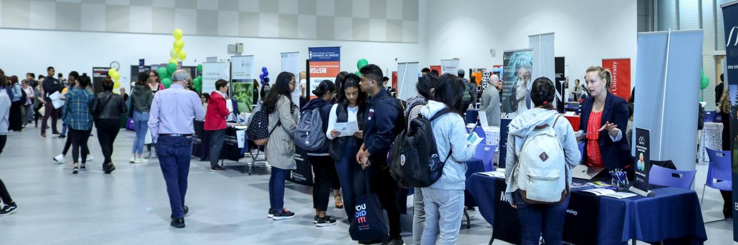 Exhibitors and attendees at a Fair inside the Highland Hall Event Centre at UTSC.
