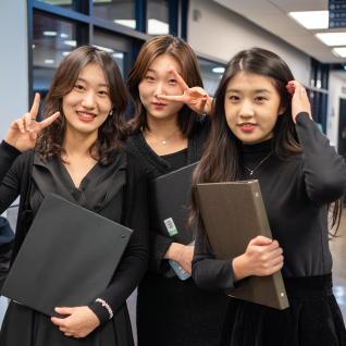 Three Choir students posing for a photo