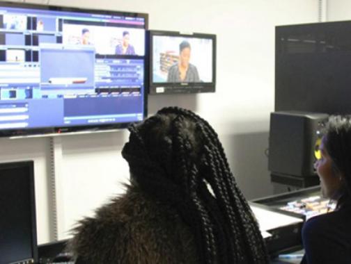 Journalism students editing footage from live recording.