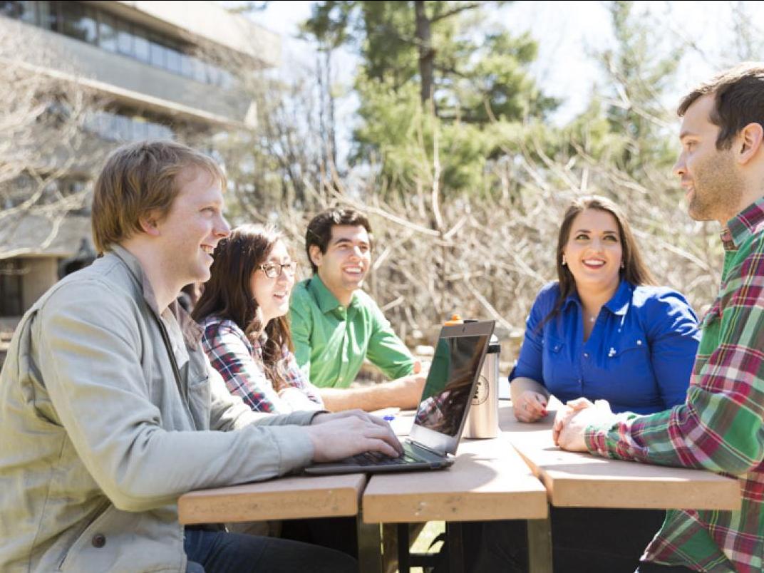 Students sitting at an outdoor table