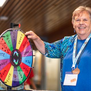 an alumni from the first UTSC class spins the wheel