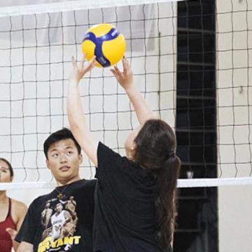 students playing volleyball