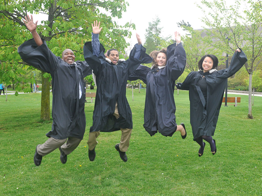 alumni students jumping