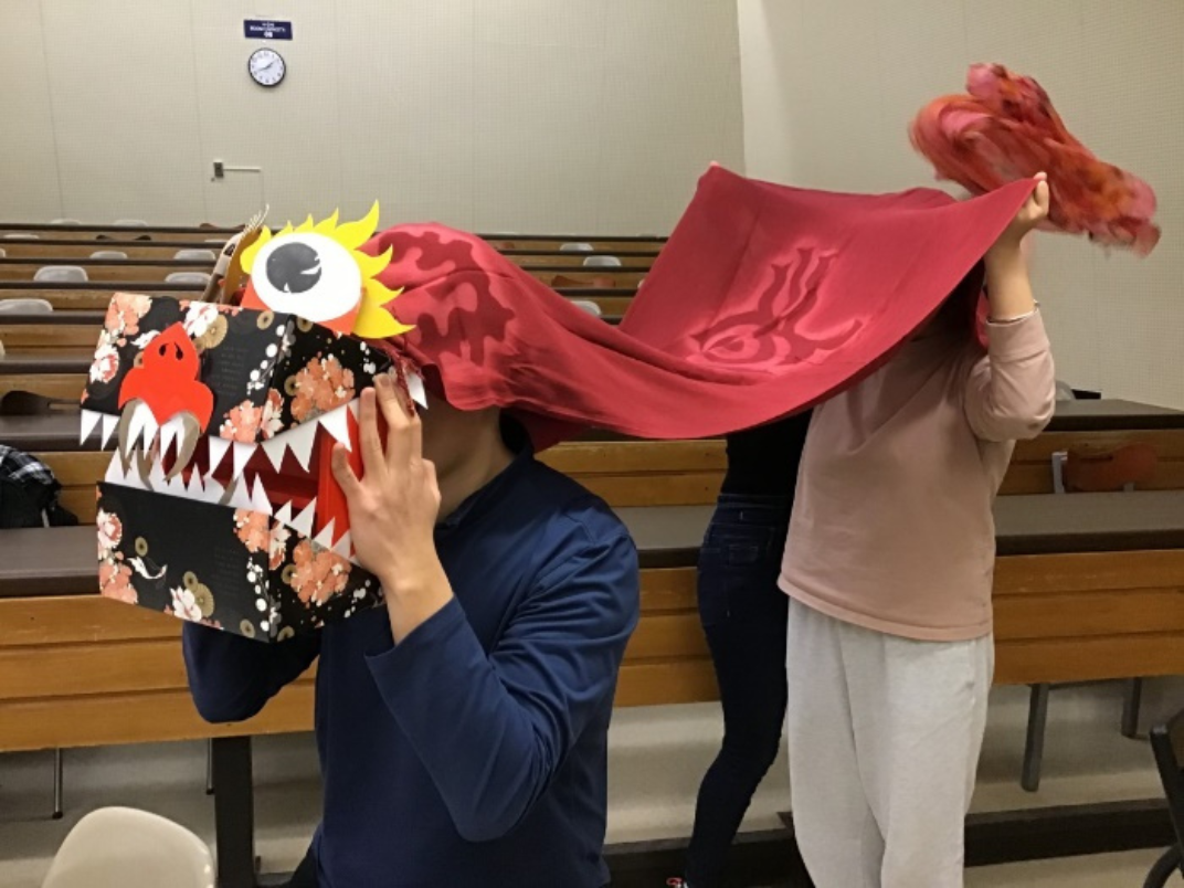 Students wearing a Chinese lion dance costume