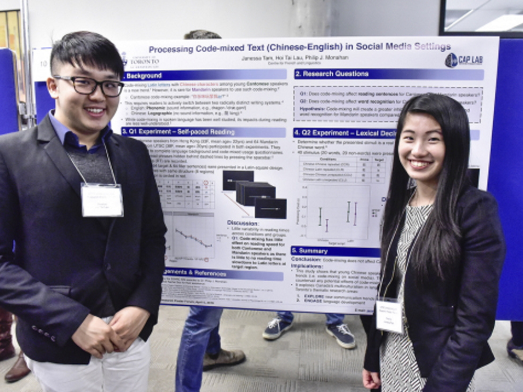 Students standing in front of a research poster