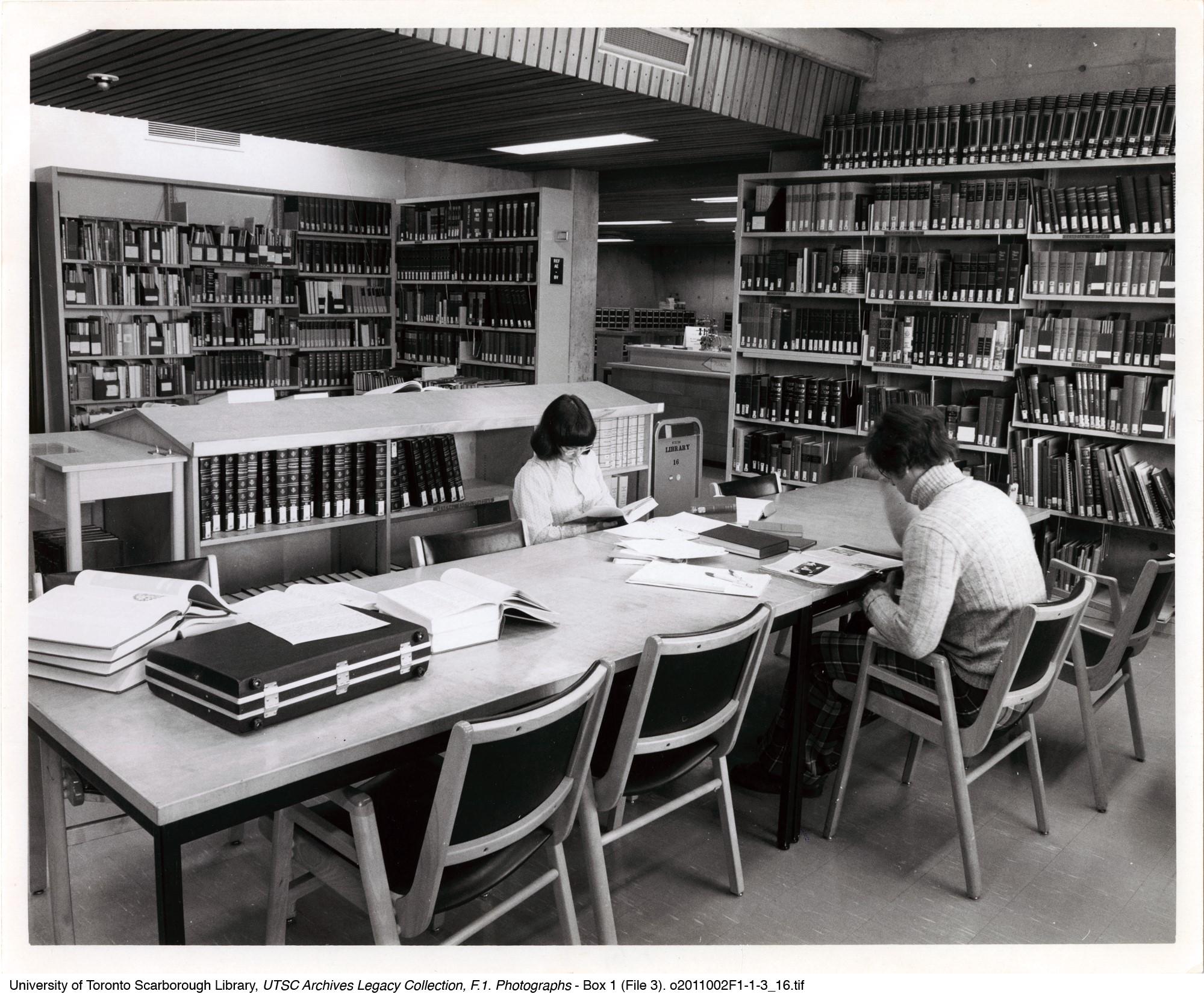 	Students in the temporary library. Inscribed on back: Library in Science Wing, 1970s. LG-1 Photograph has yellowing, cockling, creases & dents.