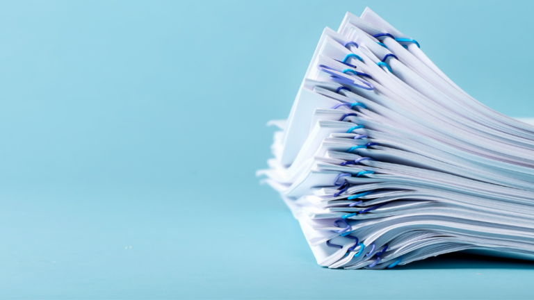 Stack of paper with blue background