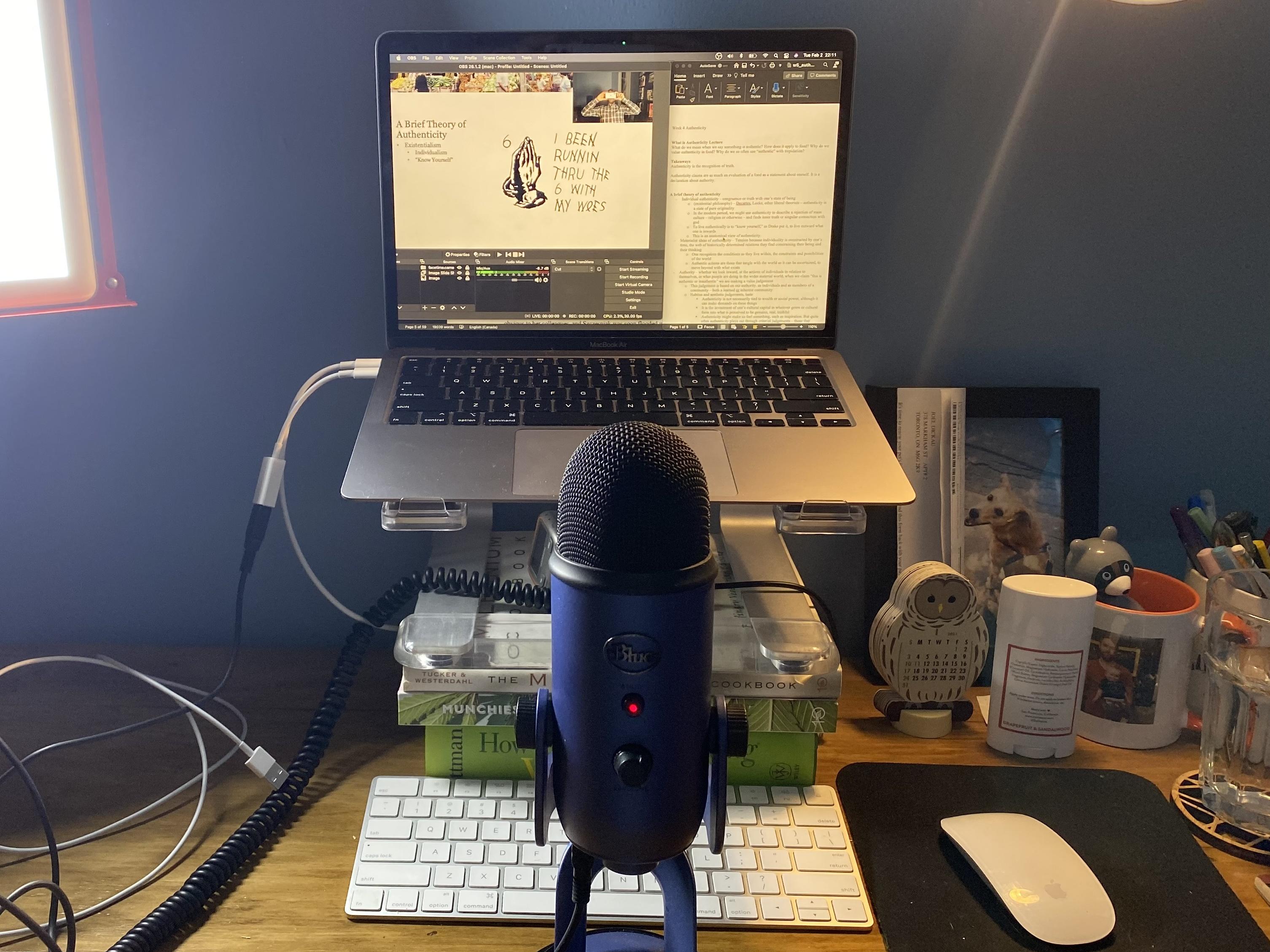 podcast microphone at messy desk