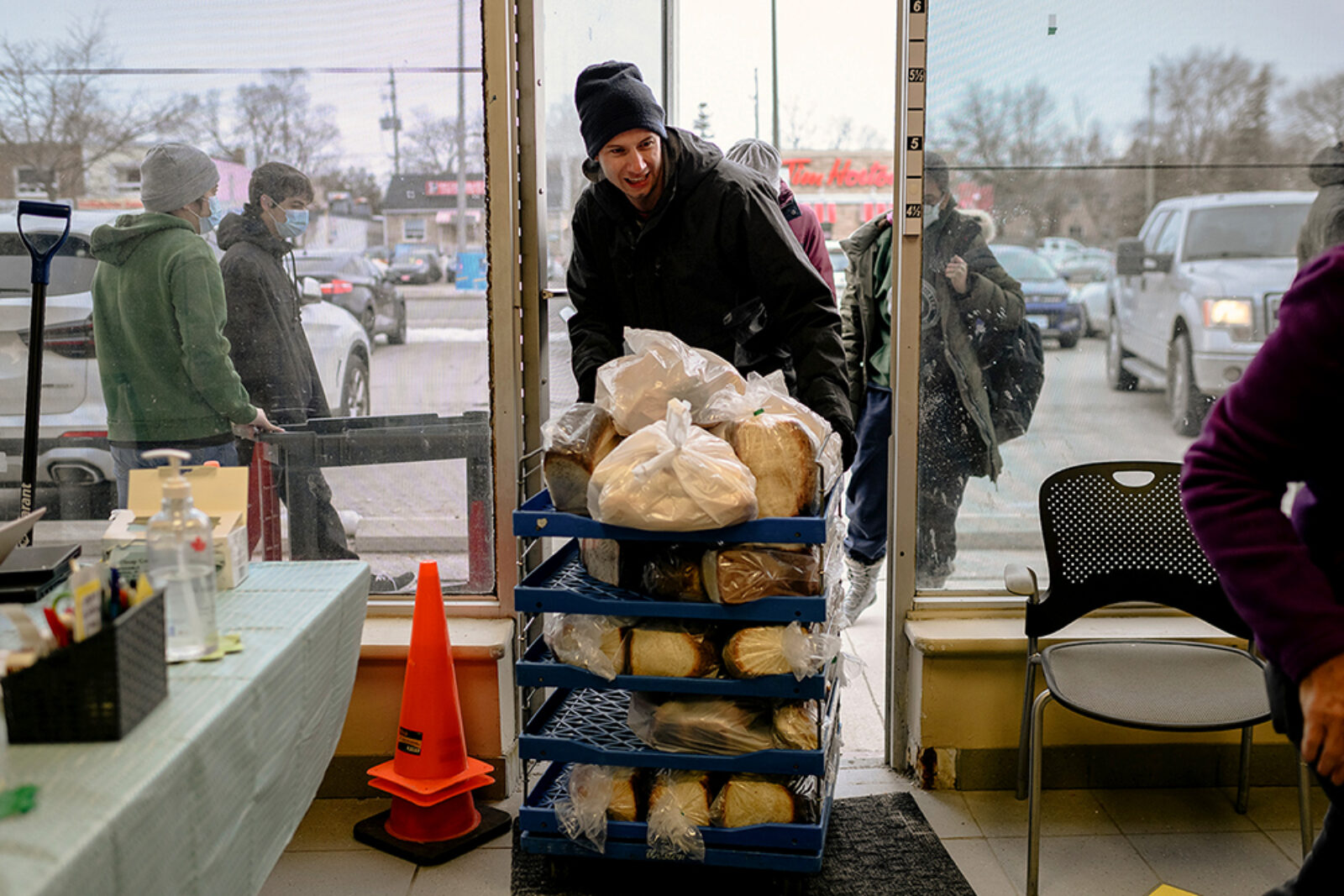 Chris, a volunteer with the Scarborough Food Security Initiative, delivers bread to the Cliffside food bank