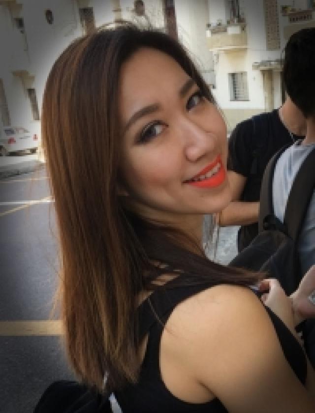 Angled side-profile headshot of Shana Ye wearing a sleeveless black top