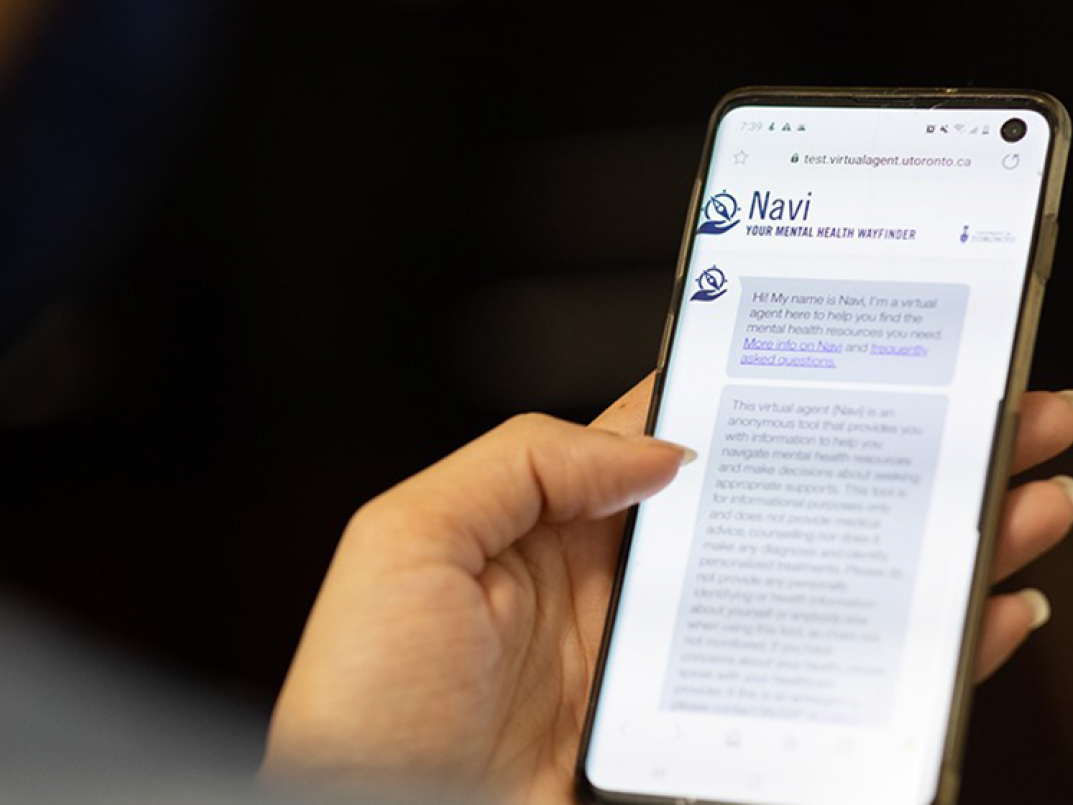 Navi UofT's mental health wayfinder  - pic of cell phone with home page of chatbot