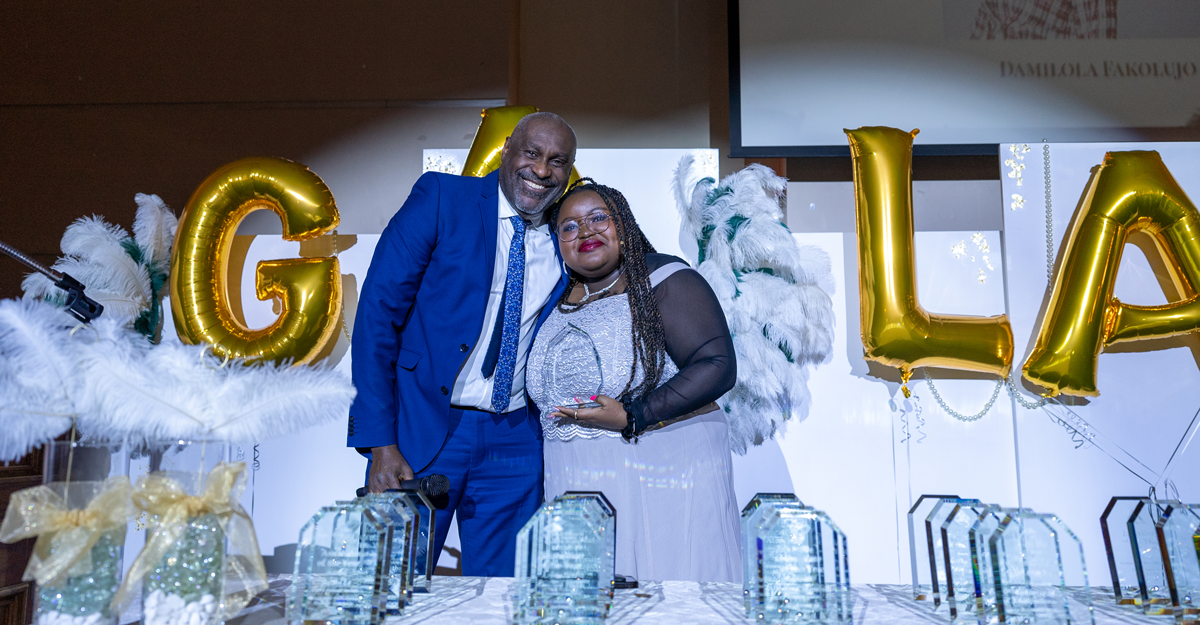 Pictured: Philip Brown, Assistant Director of Management Co-op, presents Lola Fakolujo with the Management Co-op Student of the Year Award during the Management Gala on March 17, 2023.