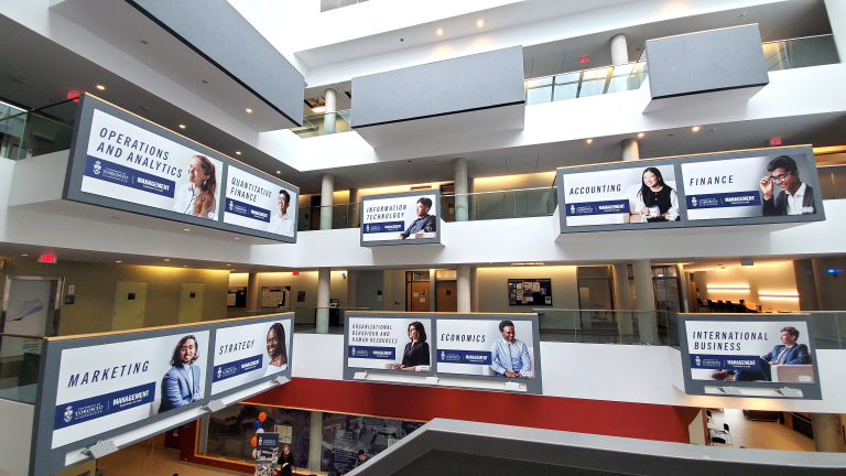 Wide-angle view of the Instructional Centre atrium at U of T Scarborough depicting the many BBA specialization areas.
