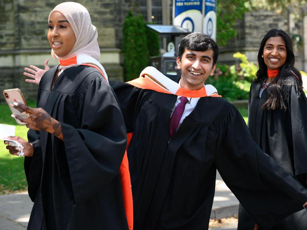 UTSC Management students arrive at Convocation Hall on their graduation day.