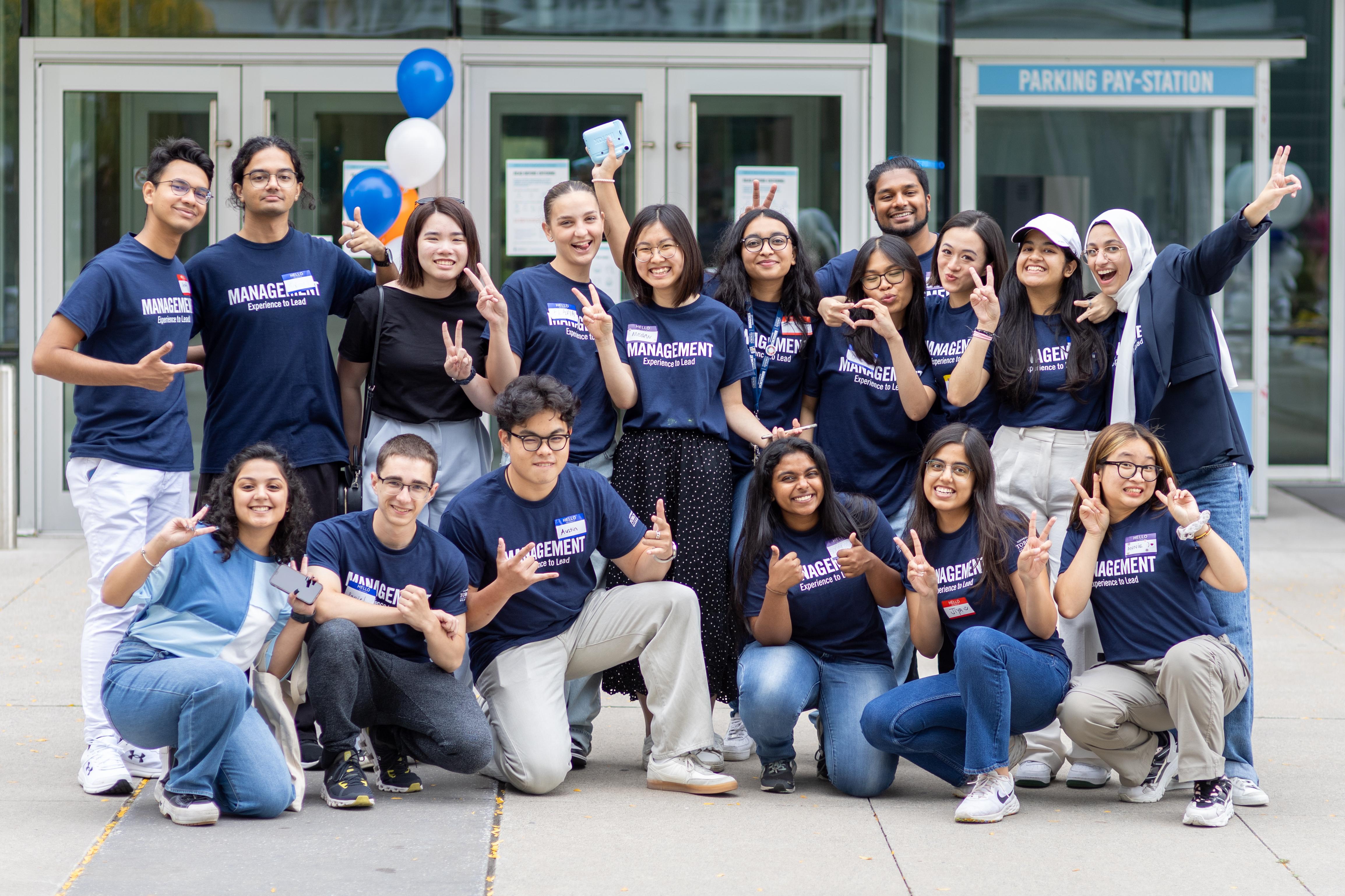 Group photo of the Management and Economics Students' Association (MESA) celebrating at Management Orientation outside of the Instructional Centre at the University of Toronto Scarborough.