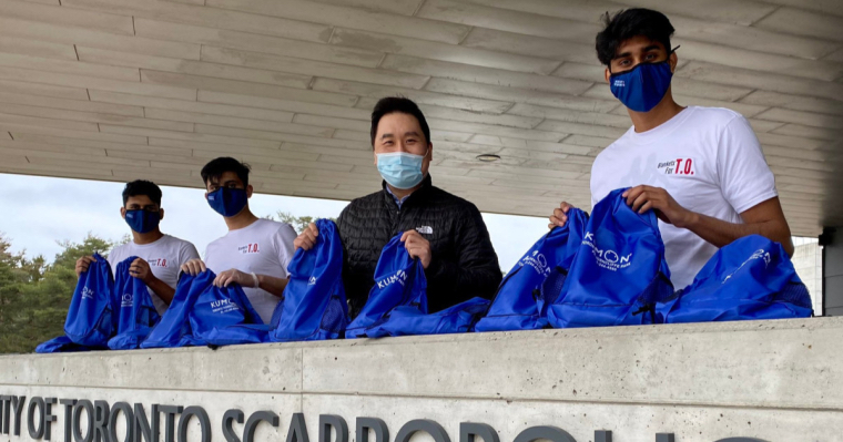 (From left) Nimit Vediya, Naman Sharma, MP for Scarborough North Shaun Chen, and Rushil Dave hold donation bags made at a 2021 event