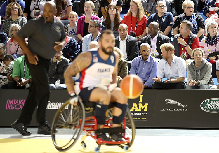 Obama and Prince Harry speak while watching a game of wheelchair basketball at the Toronto Pan Am Sports Centre at U of T Scarborough (photo by Chris Jackson/Getty Images for the Invictus Games Foundation )