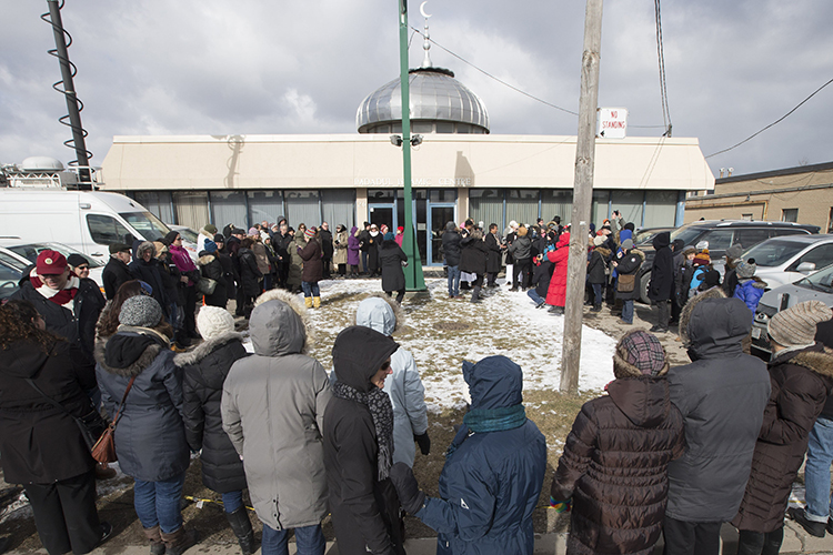 Members of the Holy Blossom Temple form a ring of hope around the Imdadul Mosque in North York in a show of solidarity with Muslims in the days following the Quebec mosque shooting (photo by Bernard Weil/Toronto Star via Getty Images)