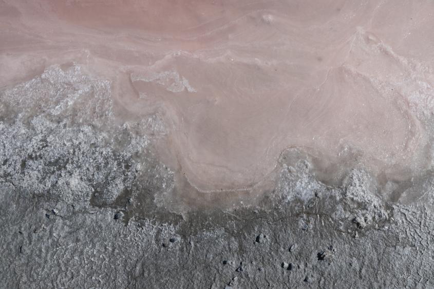 a drone photo of Owen's Lake, with pink looking water