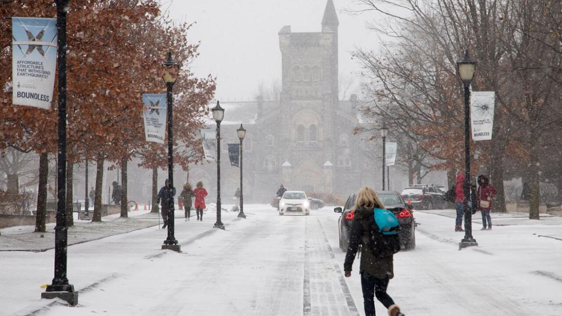 Student walking in the snow at U of T. In the fall of 2018, most international PhD students at the University of Toronto will pay tuition fees equivalent to those of domestic students.