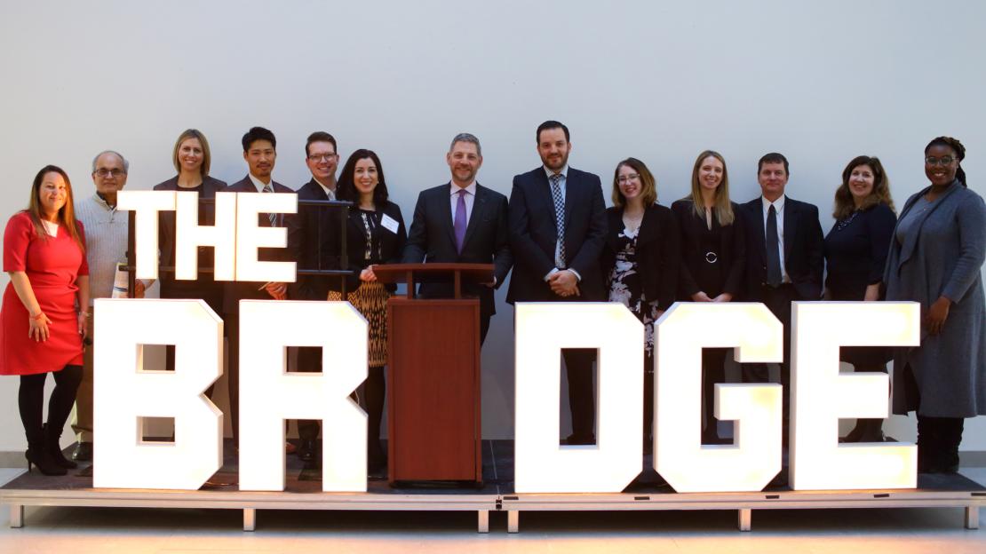 An image of The BRIDGE and the many staff and faculty that worked to bring it to UTSC.