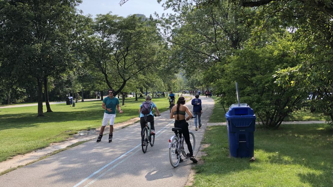 People biking, walking and roller blading on a public multi use path