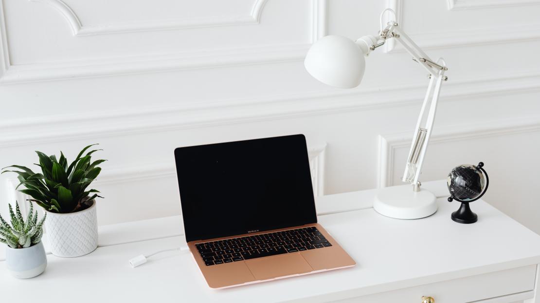 A laptop on a white desk
