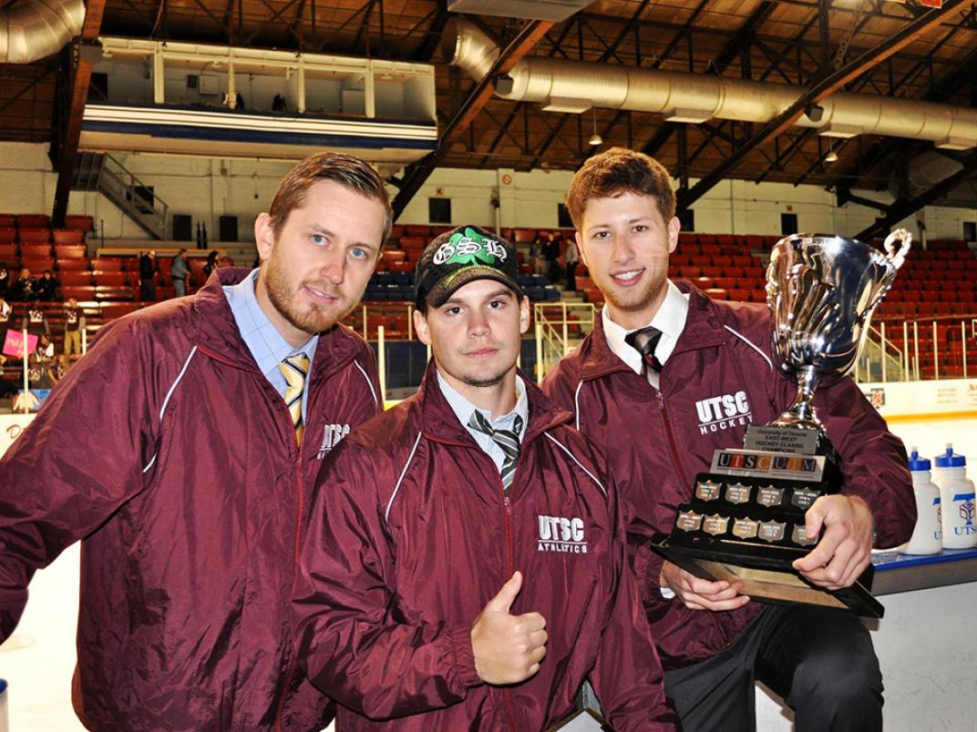 Greg Danko (far right) with Andrew Myszkowski (left) and Brodie Fitzpatrick (middle) with the East-West Hockey Classic Trophy in-hand.