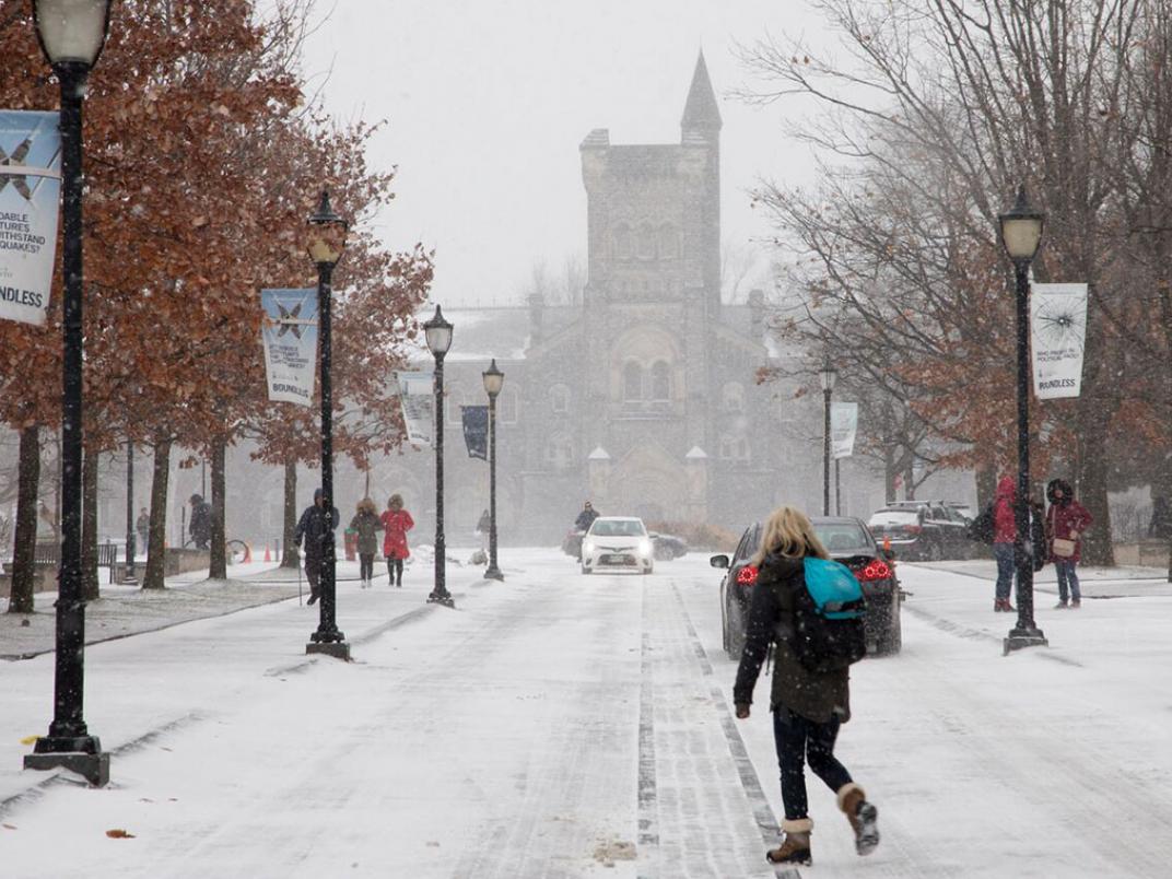 Student walking in the snow at U of T. In the fall of 2018, most international PhD students at the University of Toronto will pay tuition fees equivalent to those of domestic students.