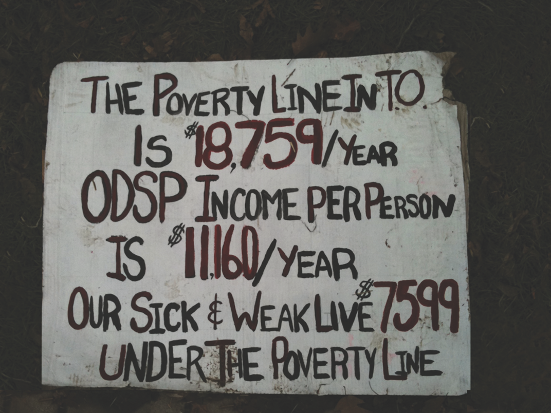 A sign photographed near St. Lawrence Market about the poverty line.