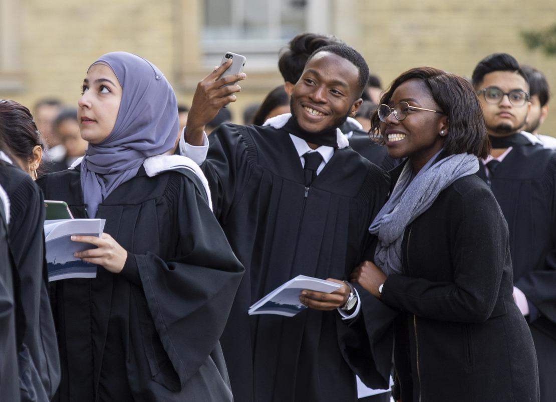 Students posing for selfie at convocation 