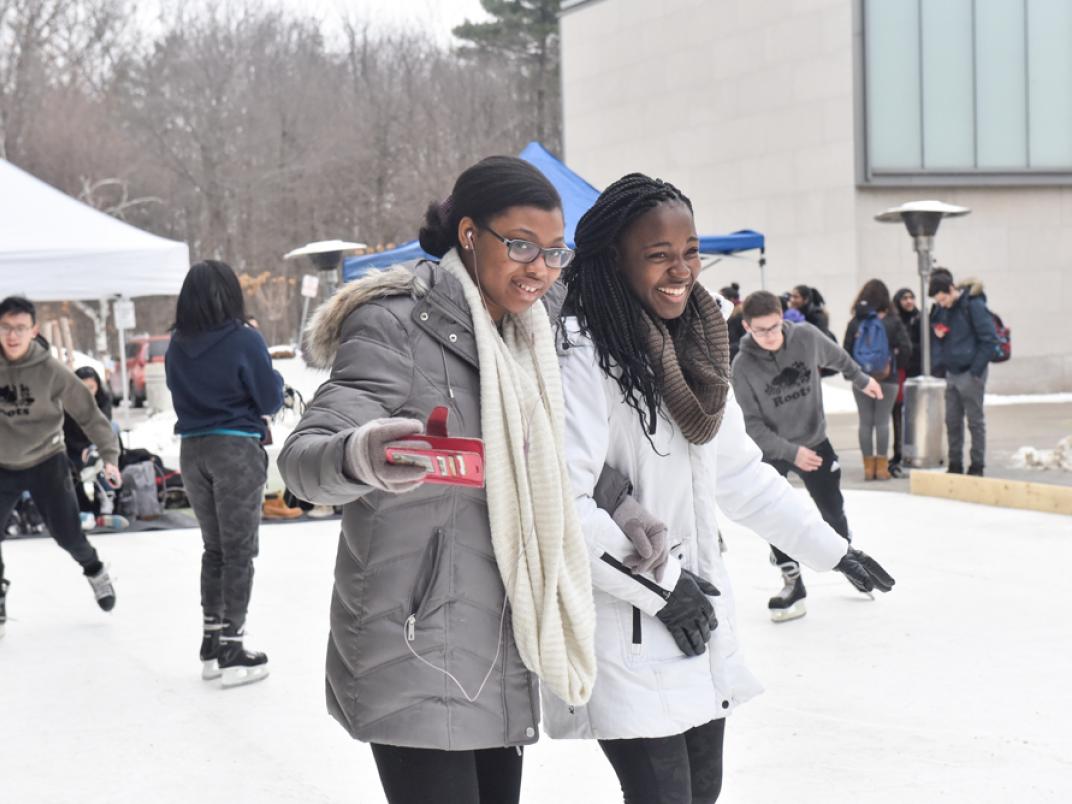 A group of University of Toronto Scarborough students practise skating on synthetic ice rink