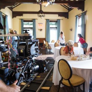 A behind-the-scenes image from "Torching the Dusties" shows cameras set up in the Miller Lash House, where the short movie was filmed.