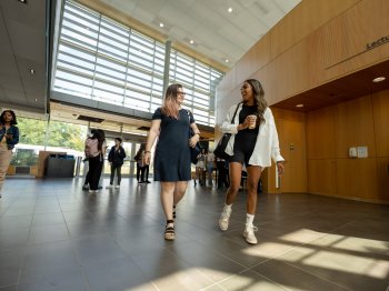 Two students walking in Highland Hall at the University of Toronto Scarborough