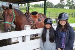Two students ready to go horseback riding