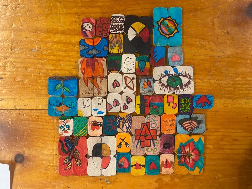 TRC project of heart artworks, coloured tiles bearing symbols of hope and unity