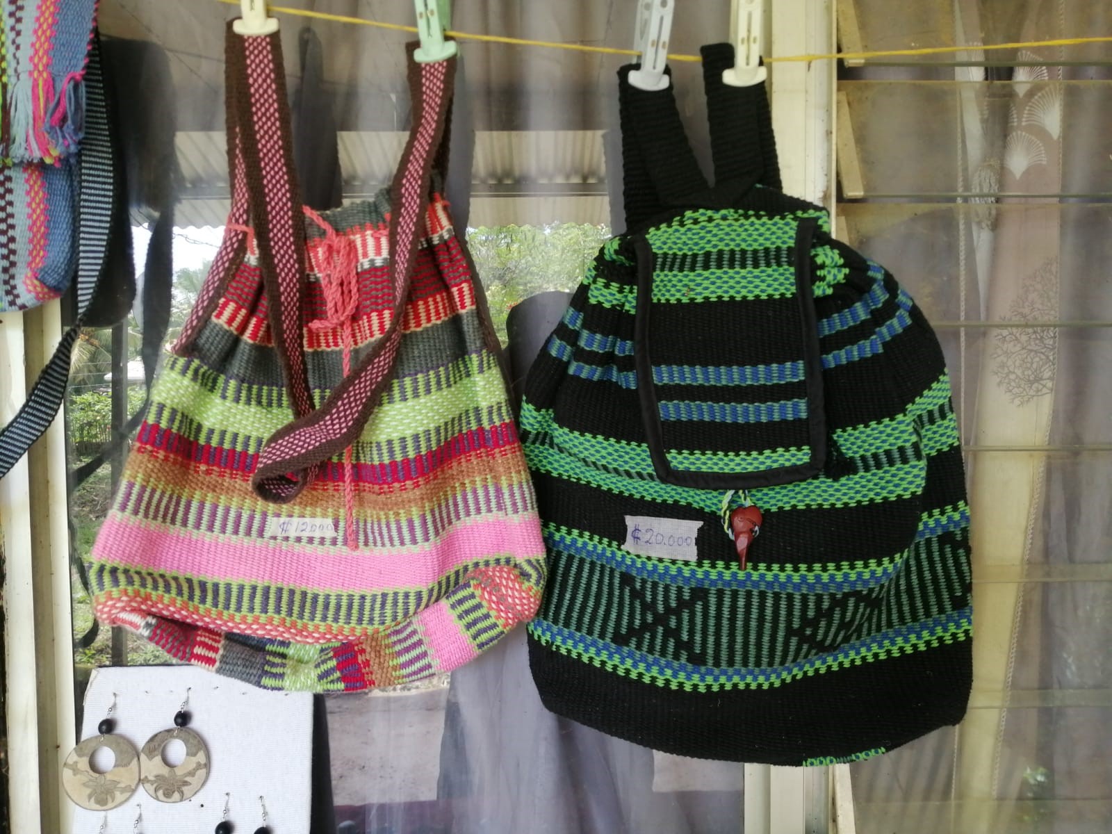 Traditional Weaved Back packs hanging from clothing lines