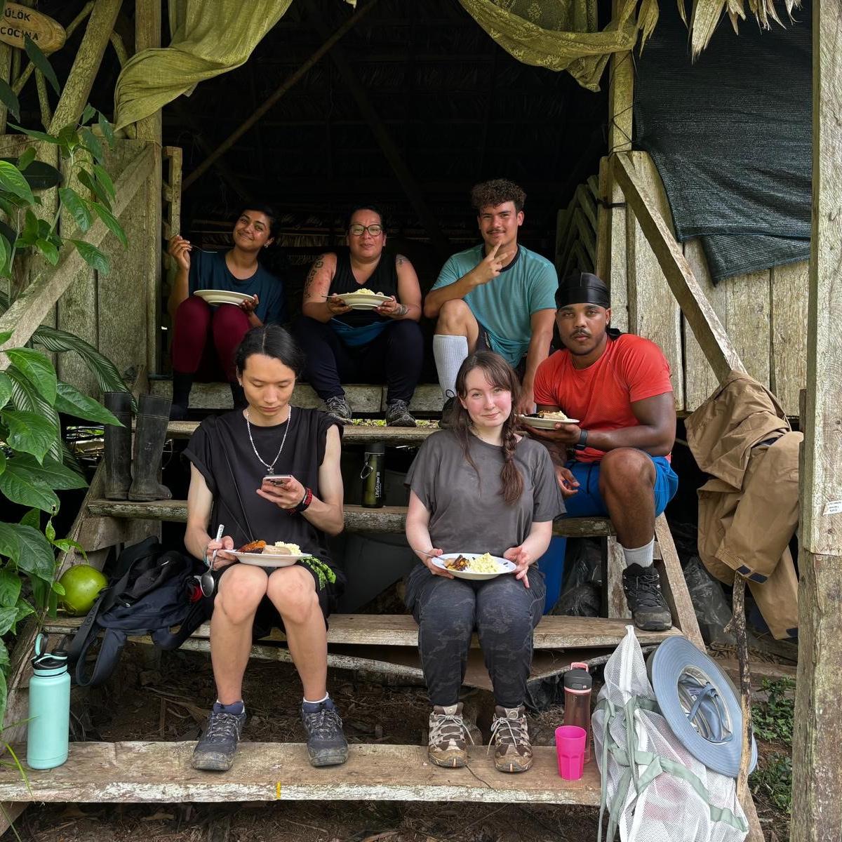 UTSC students resting outside a BriBri home in Costa Rica