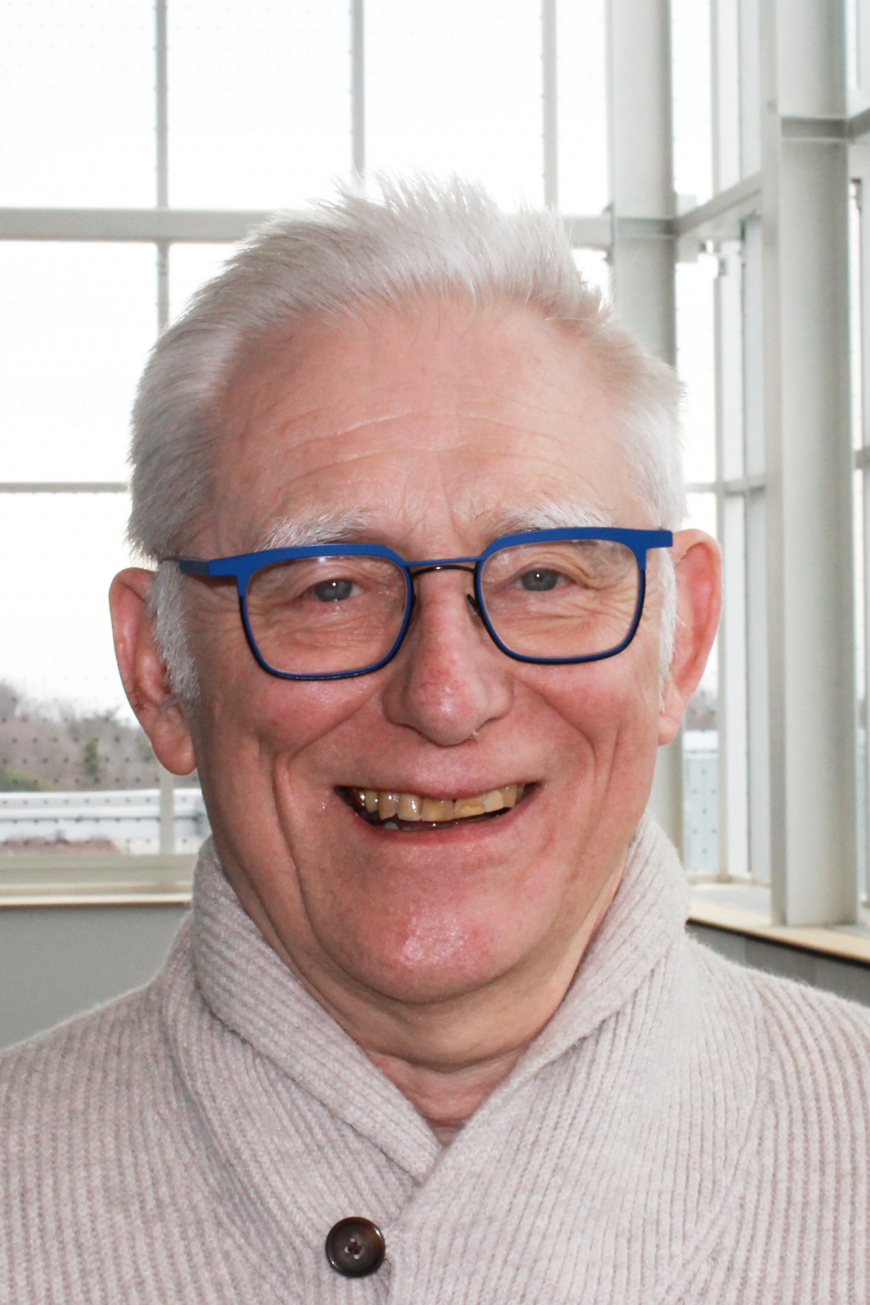John Hannigan, a man with white hair and glasses