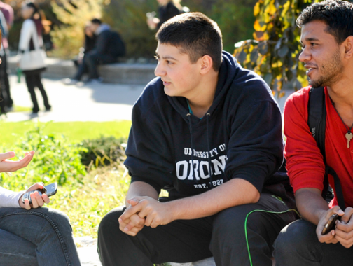 Three students talking outside