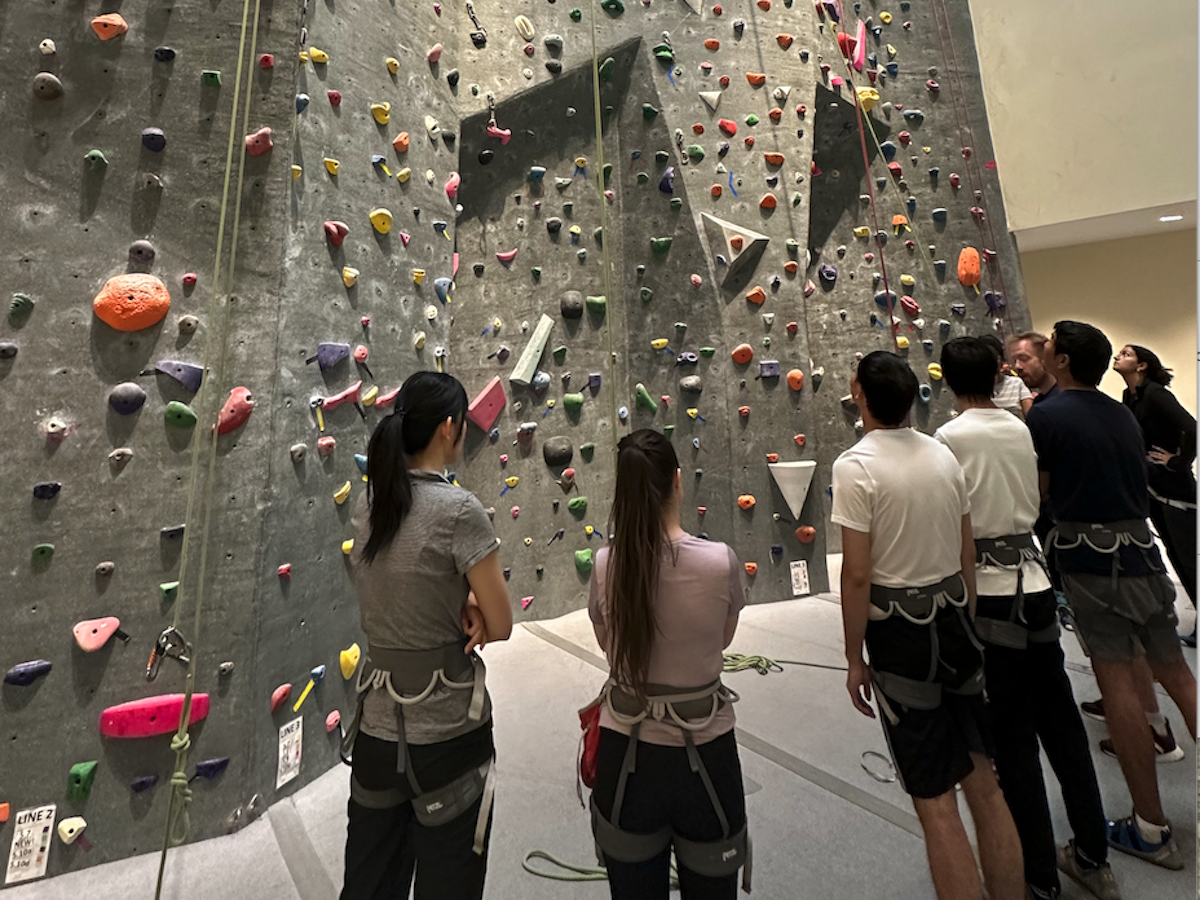 Students preparing to climb rockwall at Toronto PanAm Sports Centre